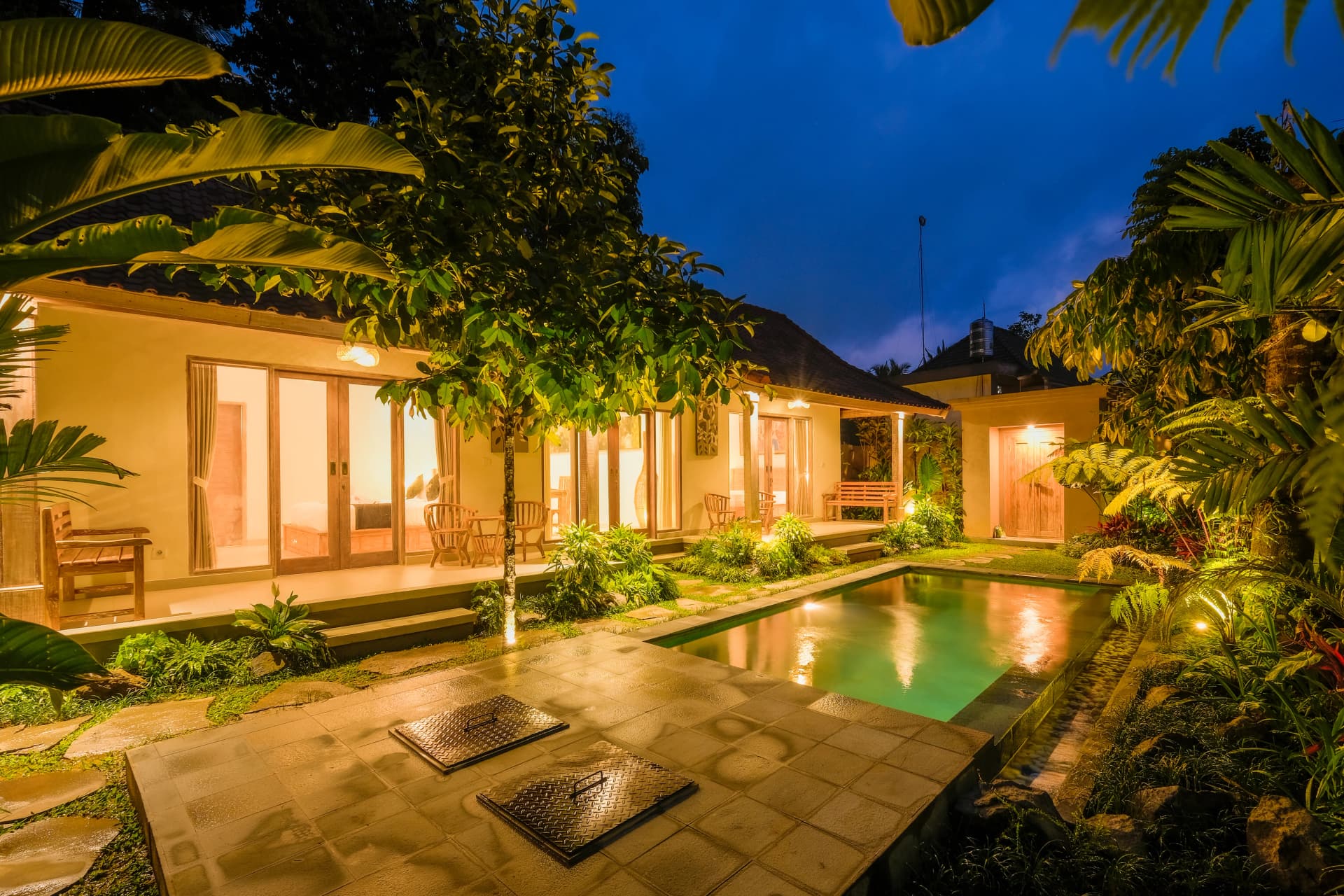 Private villa exterior surrounded by tropical garden in Ubud, Bali