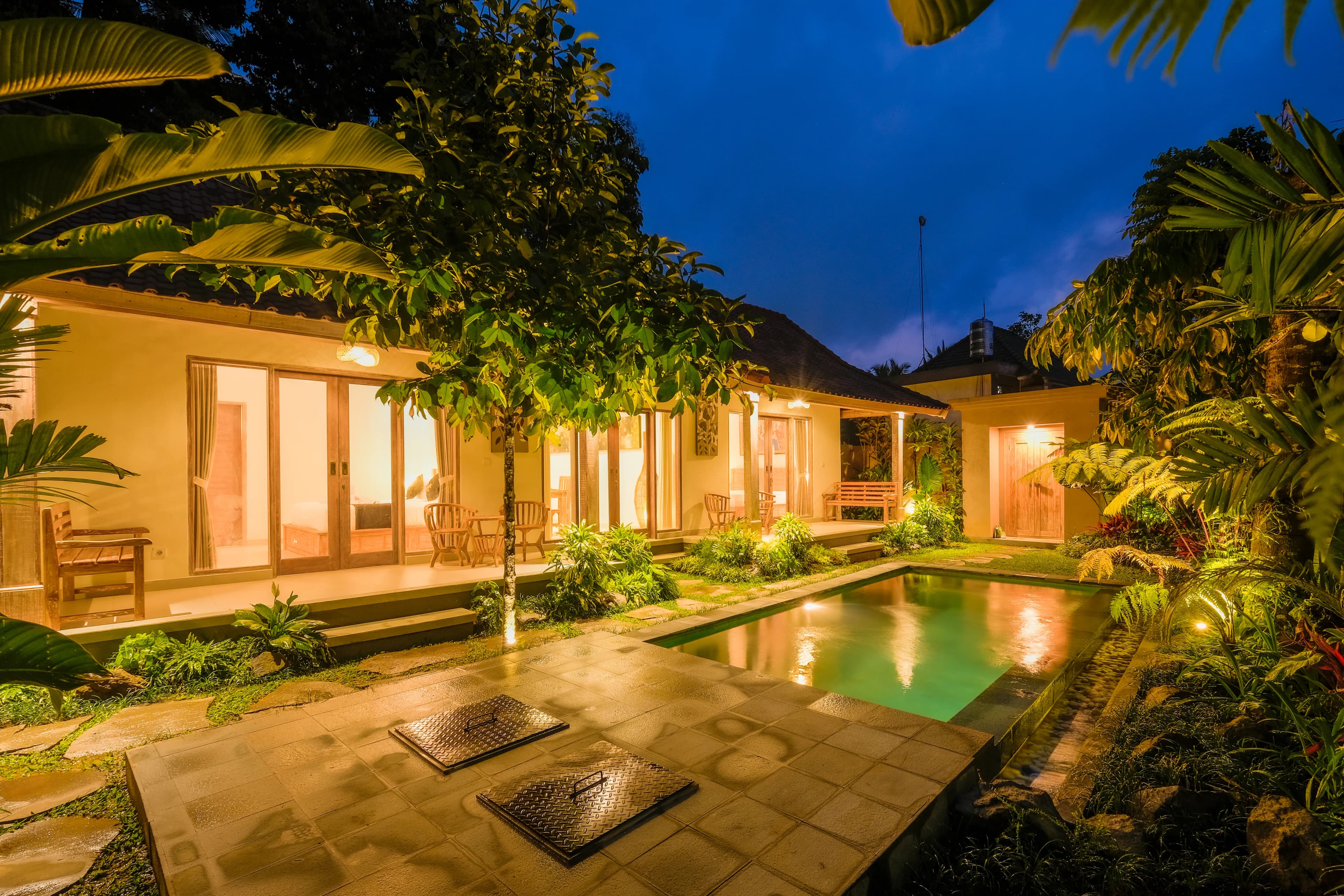 Private villa exterior surrounded by tropical garden in Ubud, Bali