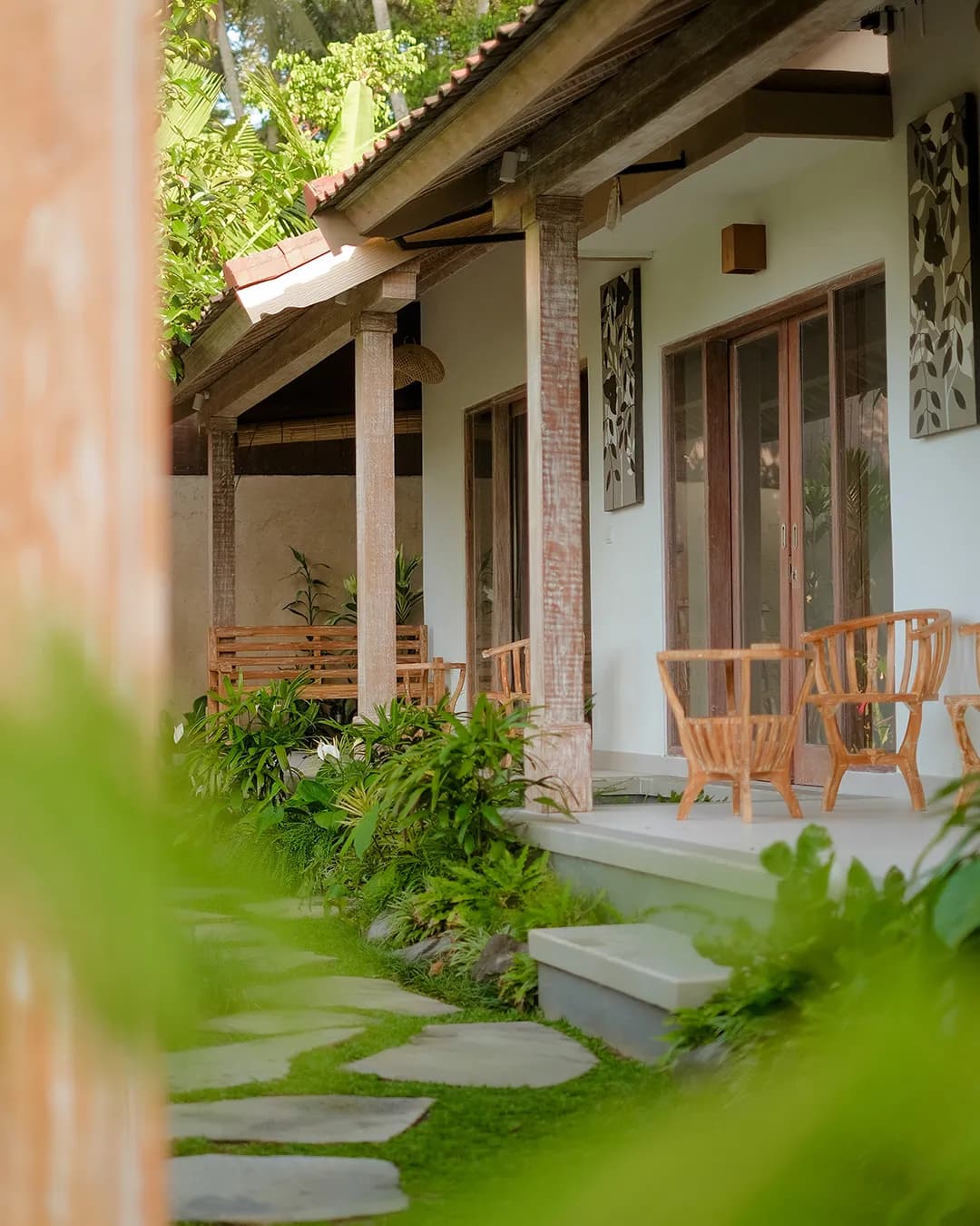 Stone pathway surrounded by lush tropical plants in Bali villa